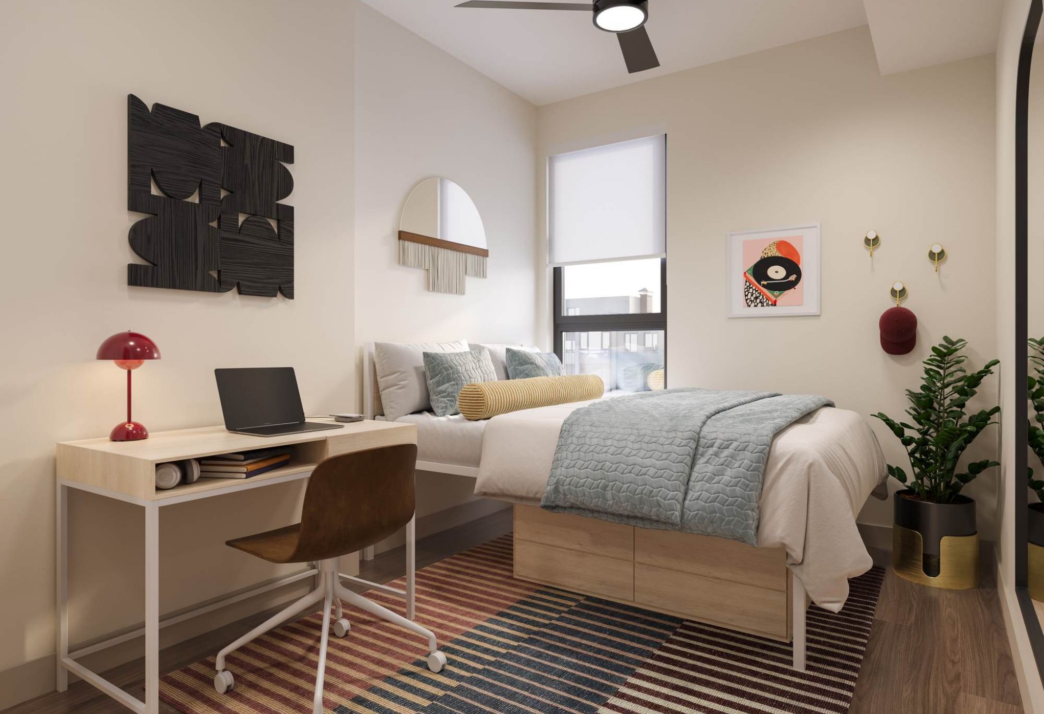 Modern bedroom at VERVE Tempe featuring a cozy bed, study desk, ceiling fan, and minimalist decor with natural light.
