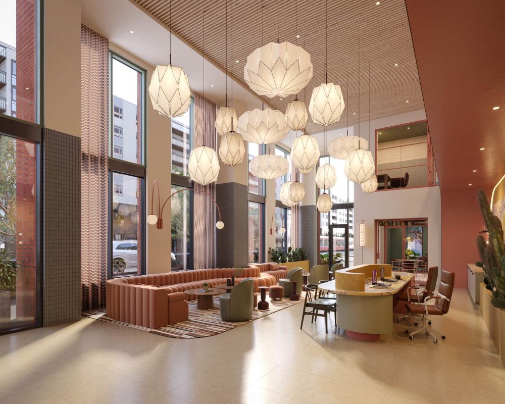Modern lobby at VERVE Tempe featuring high ceilings, sculptural pendant lights, and contemporary seating areas.